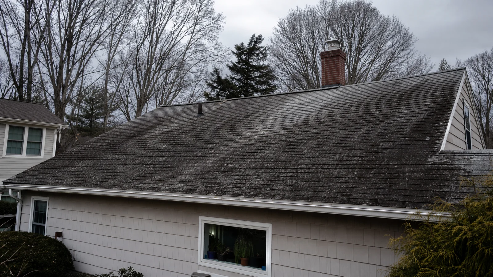 Aging asphalt roof on a Connecticut home