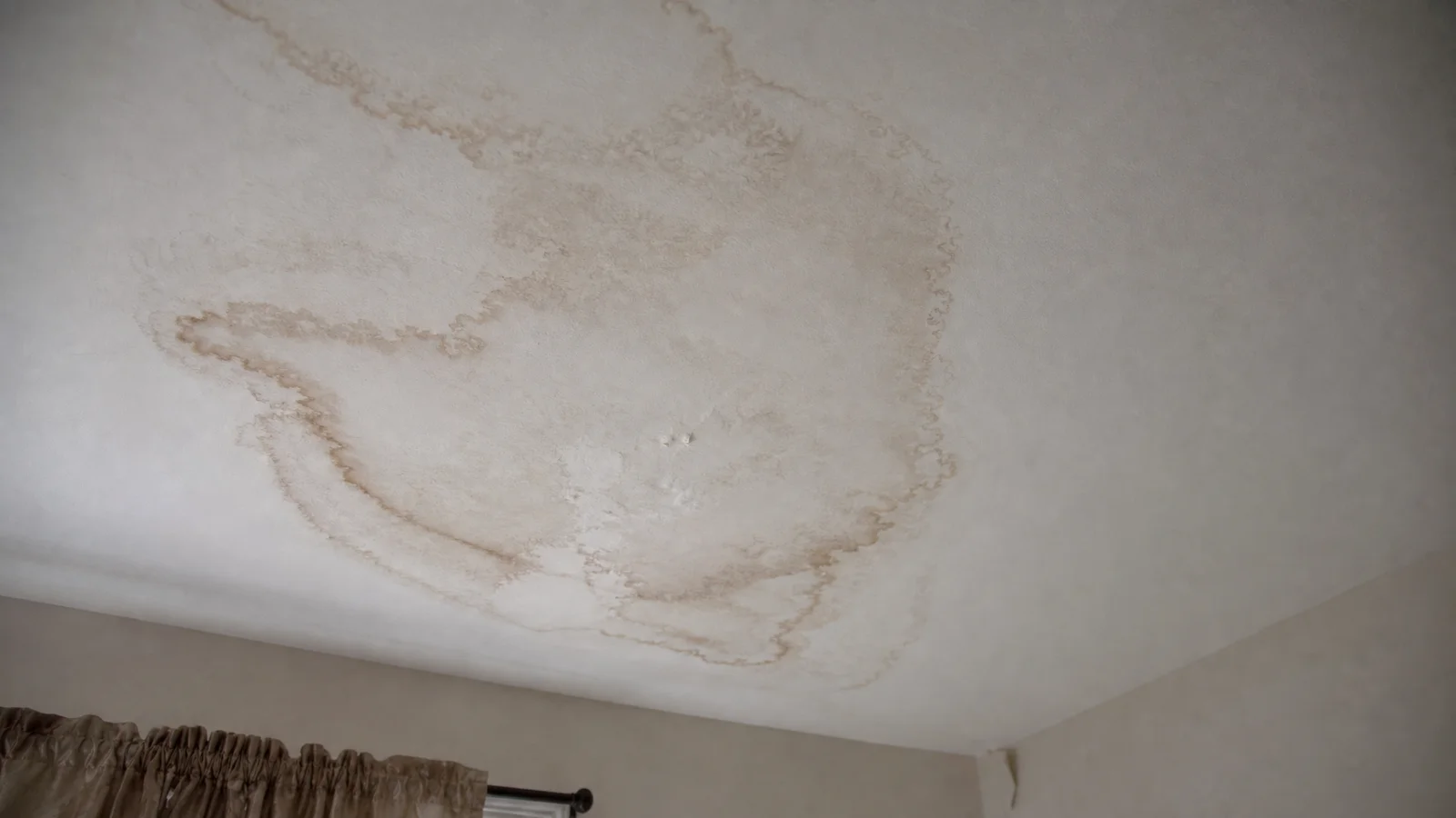 Brown water stain on a home ceiling