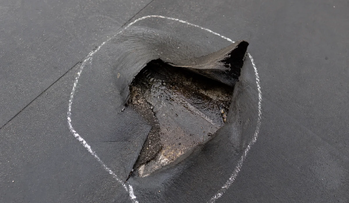 Puncture in EPDM flat roof membrane