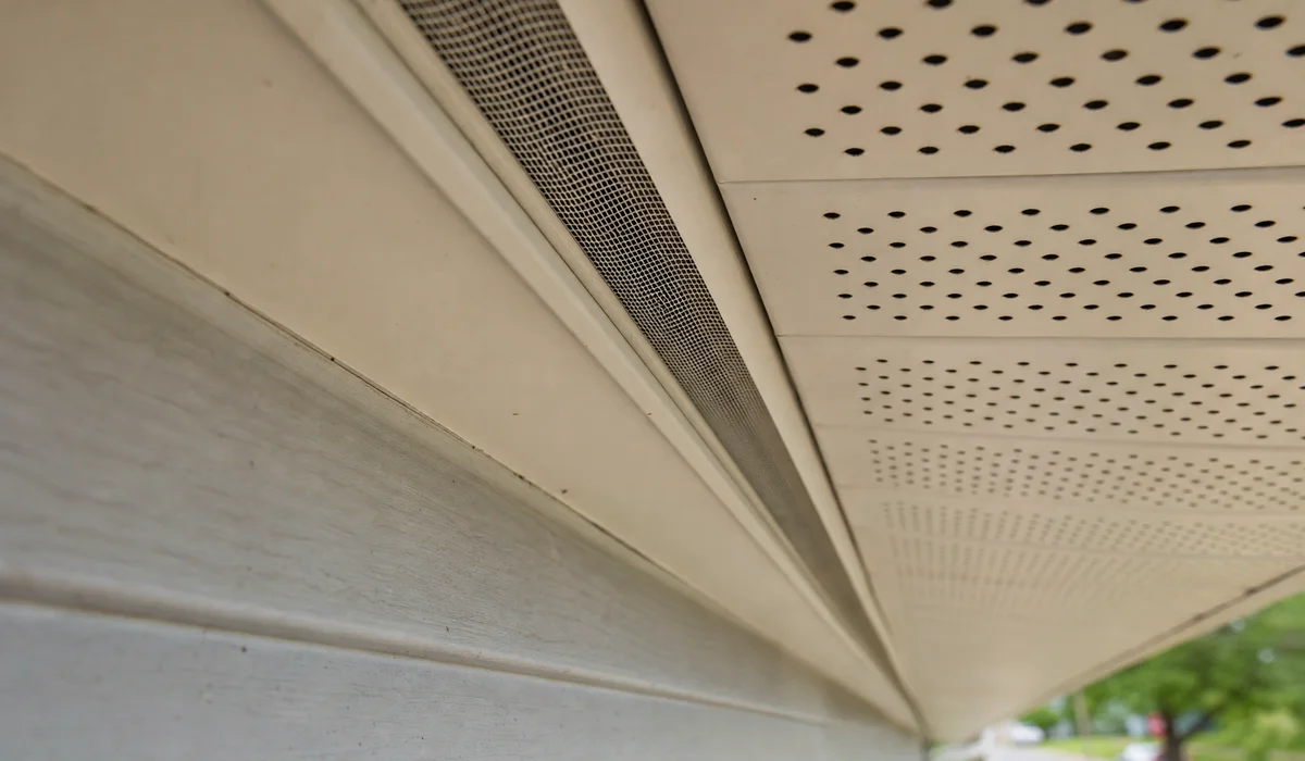 Detail of soffit vent strip installed under a roof eave overhang