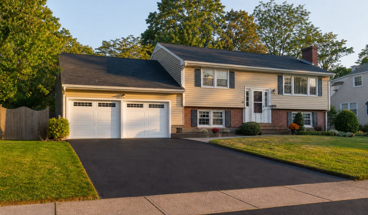 Newly completed asphalt shingle roof at end of workday