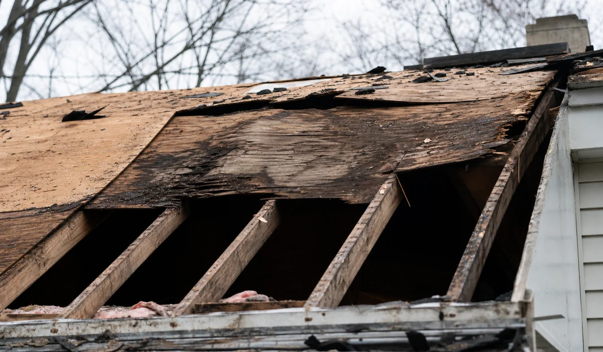 Rotted decking exposed during a roof tear-off